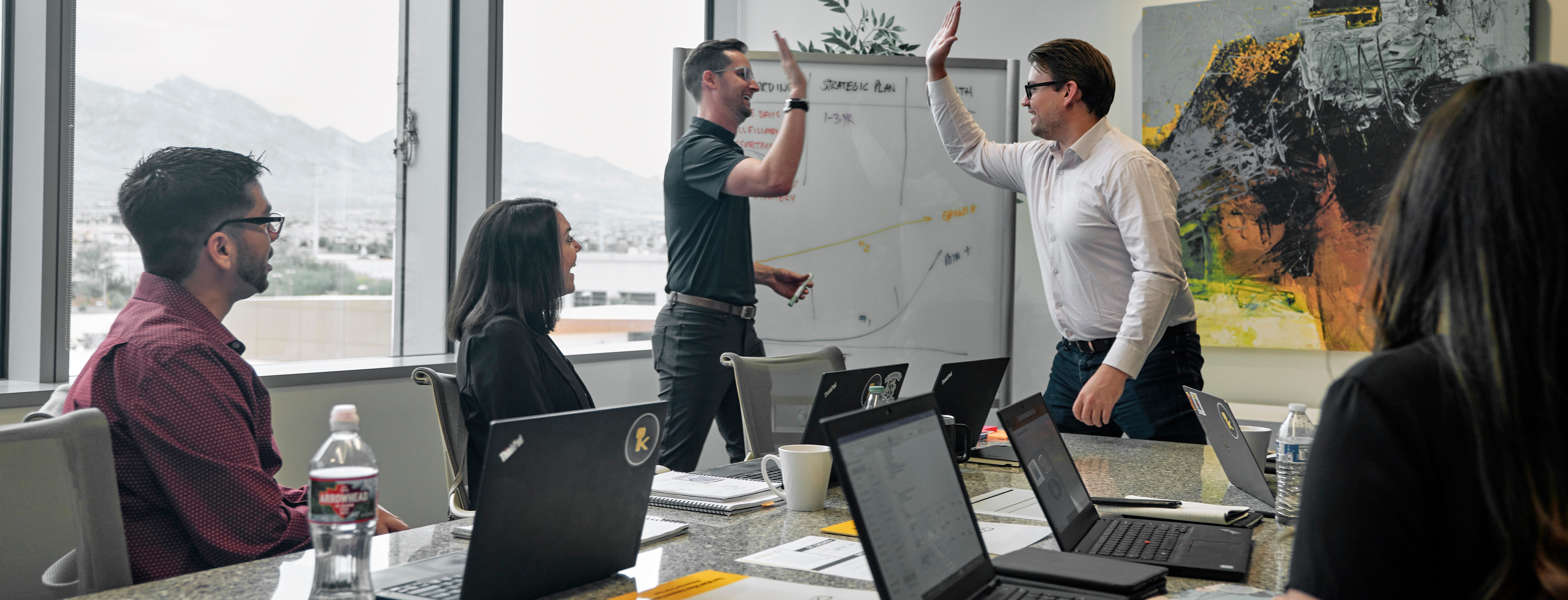 Channel Key team members giving a high five.